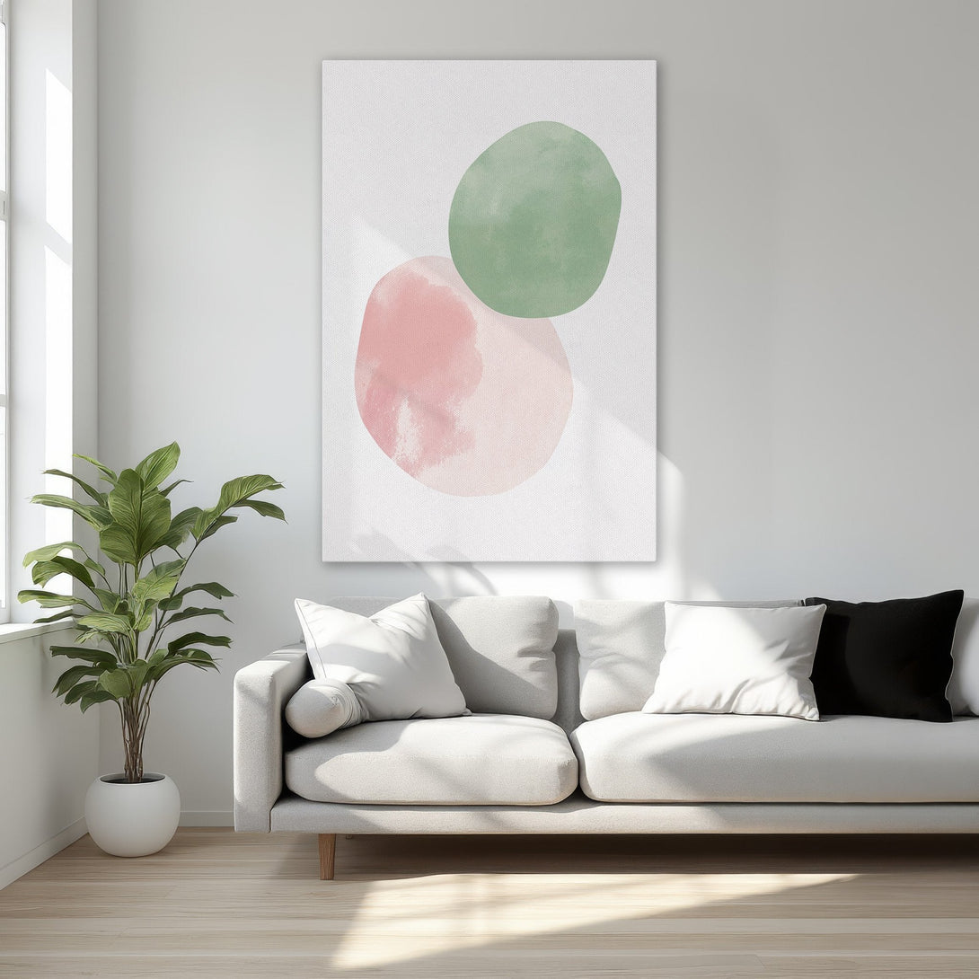 Framed Wall Art featuring abstract watercolor shapes in pink and green. Modern art print with a gold frame, perfect for bedroom decor.