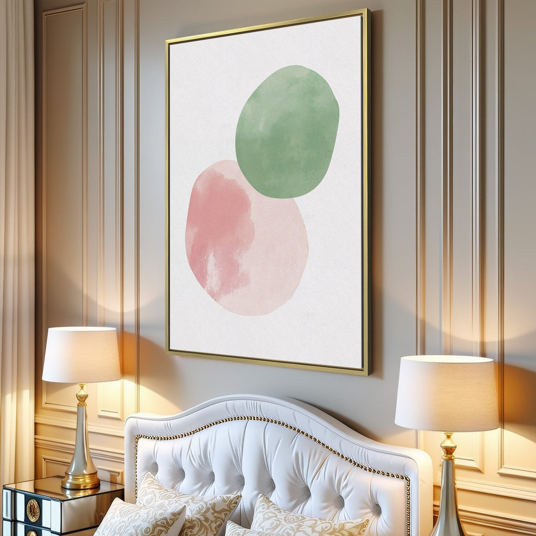 Canvas Print featuring abstract watercolor shapes in pink and green, displayed in a modern living room. Soft, neutral color palette.