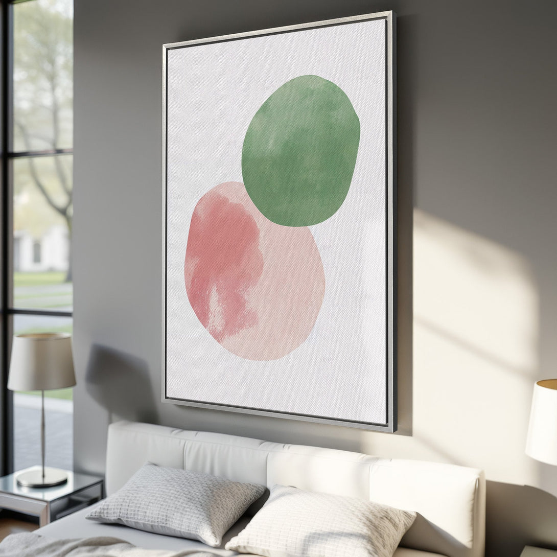 Framed Wall Art featuring abstract watercolor shapes in green and pink. Modern art canvas print perfect for bedroom decor.