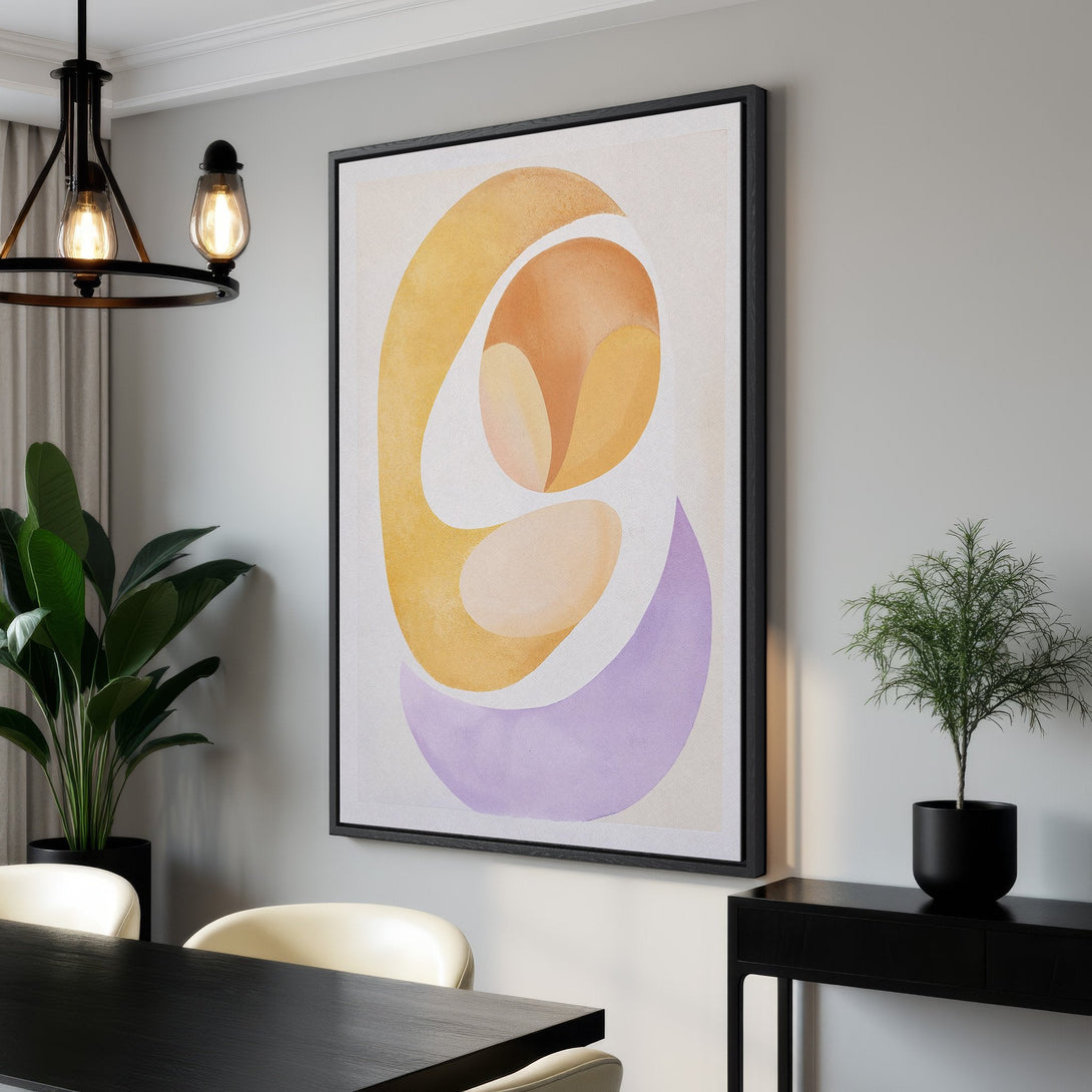 Framed Wall Art featuring abstract shapes in warm yellow, orange, and purple hues. Modern art canvas print perfect for living room or dining room decor.