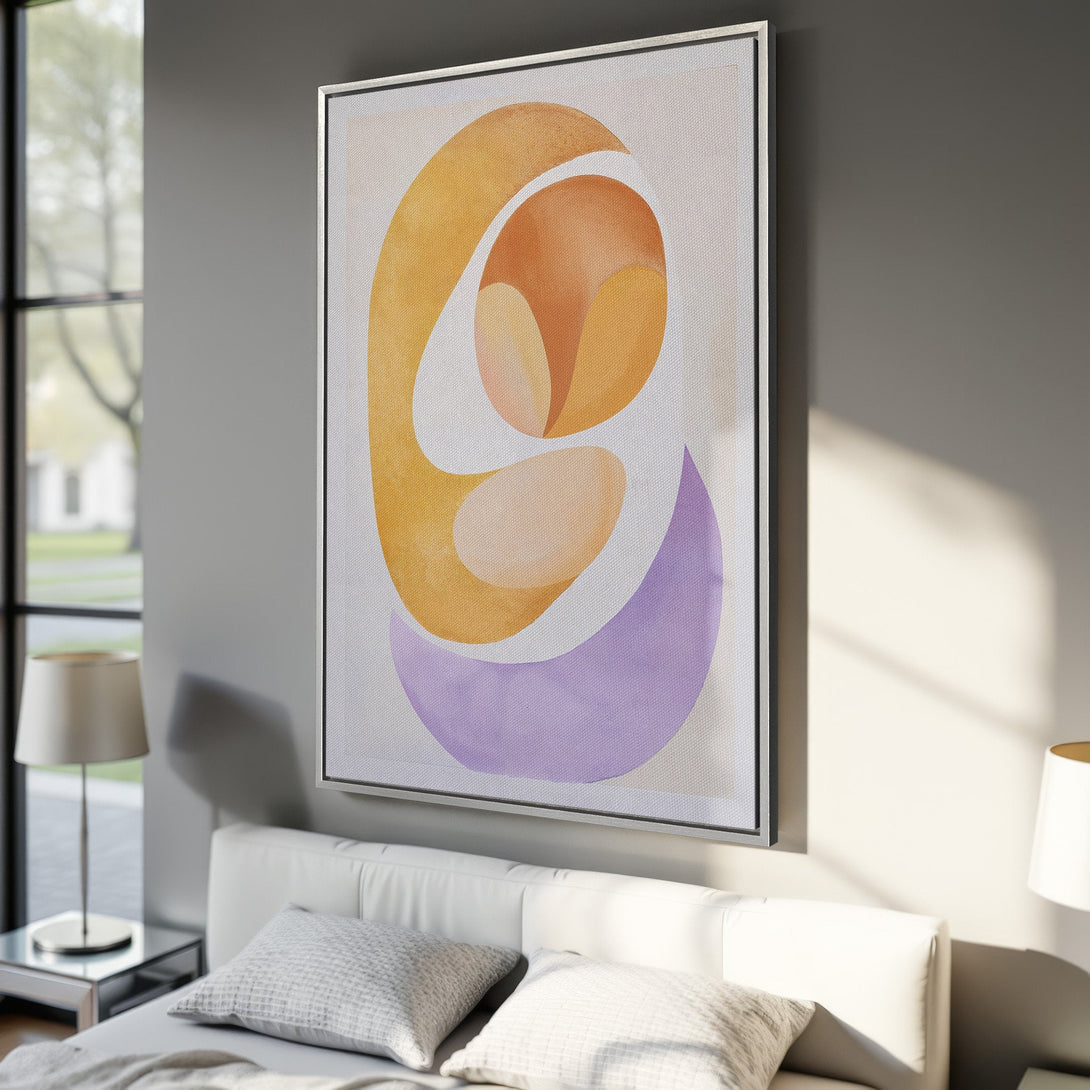 Framed Wall Art featuring an abstract design with warm yellow, orange, and purple hues, perfect for adding a pop of color to any modern interior.