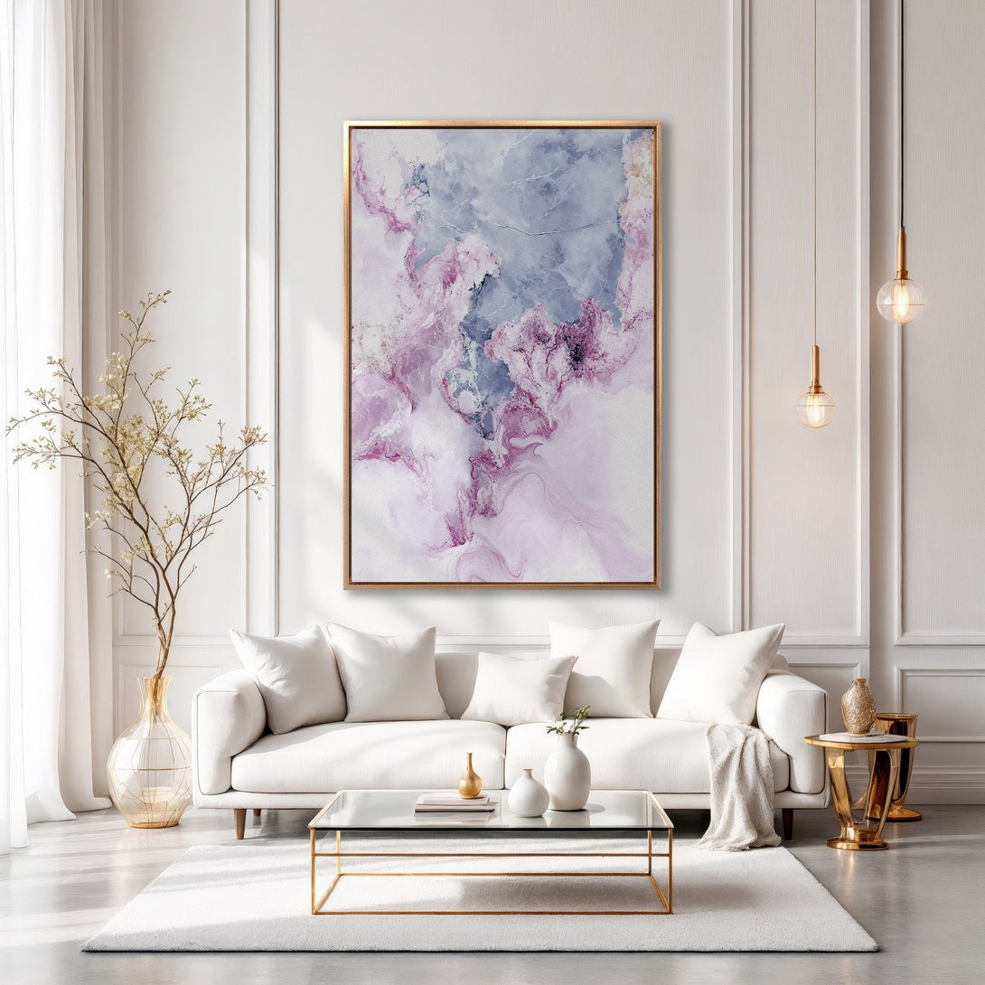 Framed Wall Art: Abstract art print in a modern living room. Features a gold frame, with a pink, purple, and blue color palette. Perfect for home decor.