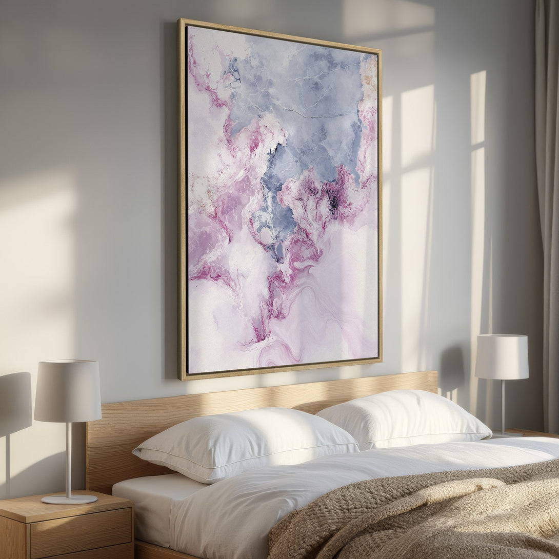 Framed Wall Art featuring an abstract painting in a bedroom. Soft, flowing style with a calming palette of pink, purple, and gray. Elevate your space!
