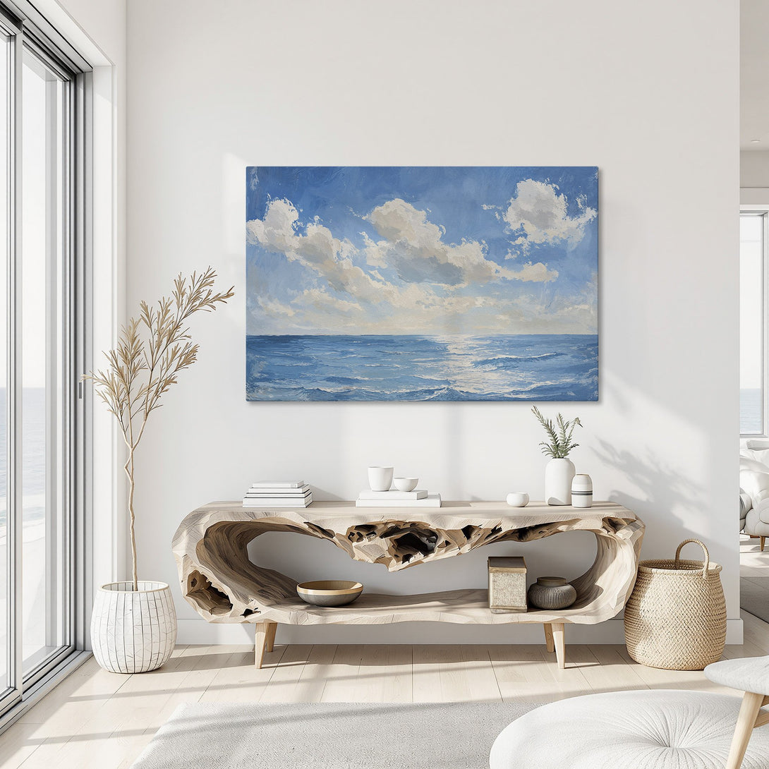 Framed Wall Art: Ocean landscape canvas print in blue and white, displayed in a modern interior. Bring the serenity of the sea to your home!