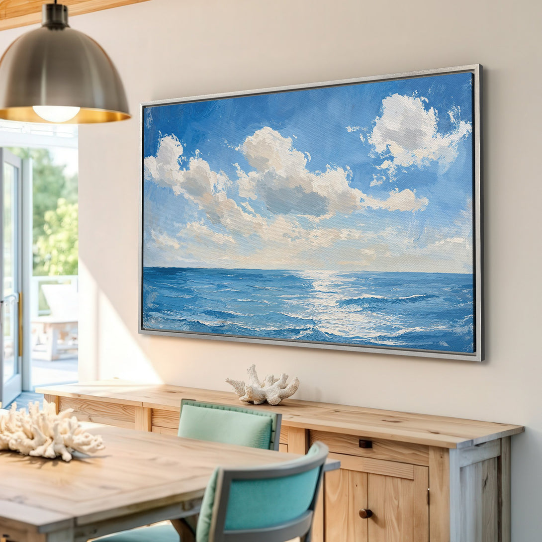 Framed Wall Art: Ocean landscape Canvas Print in blue and white, perfect for coastal decor. Adds a serene touch to any room.