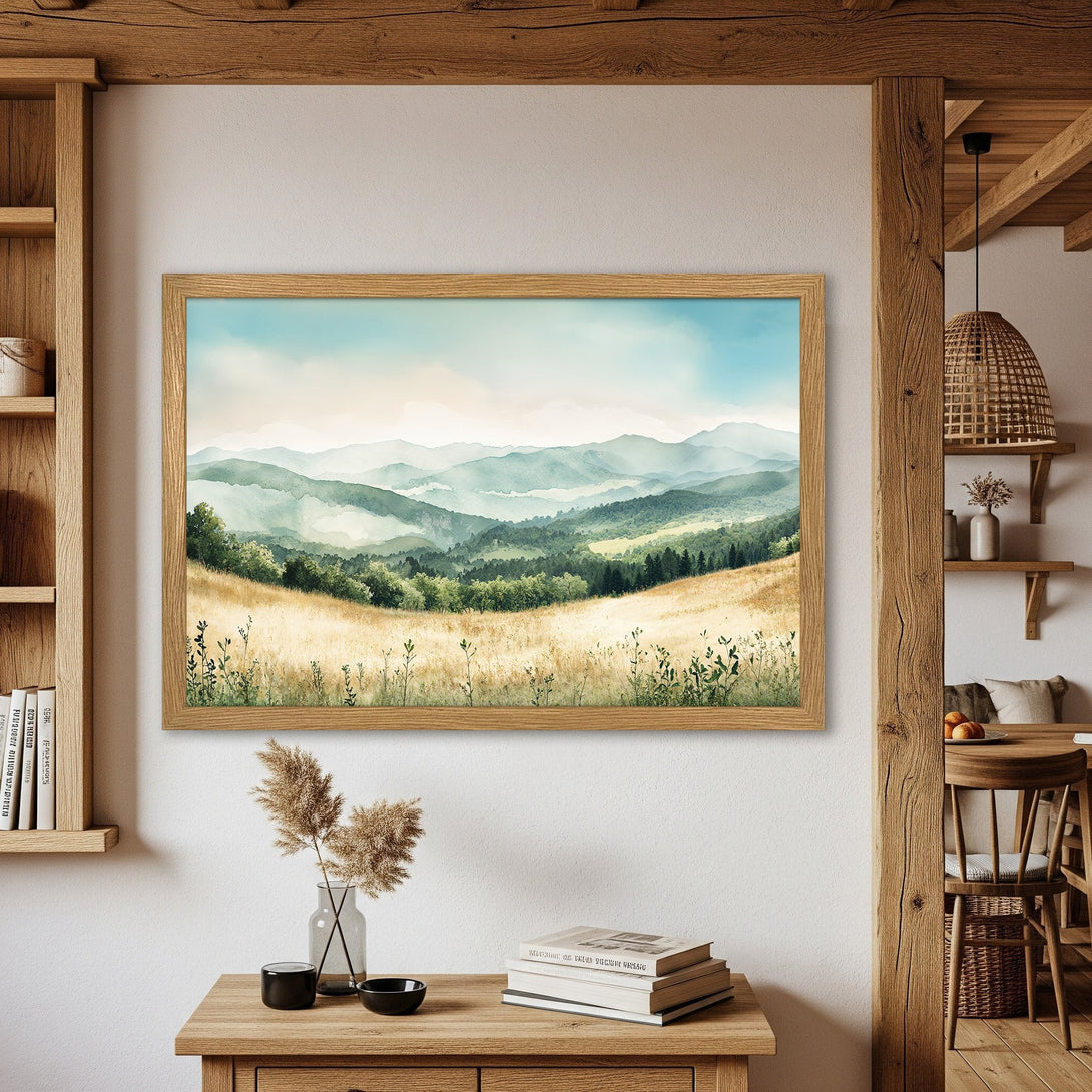 Framed Poster of a serene mountain landscape in watercolor style, featuring a calming blue, green, and gold color palette. Perfect wall art!