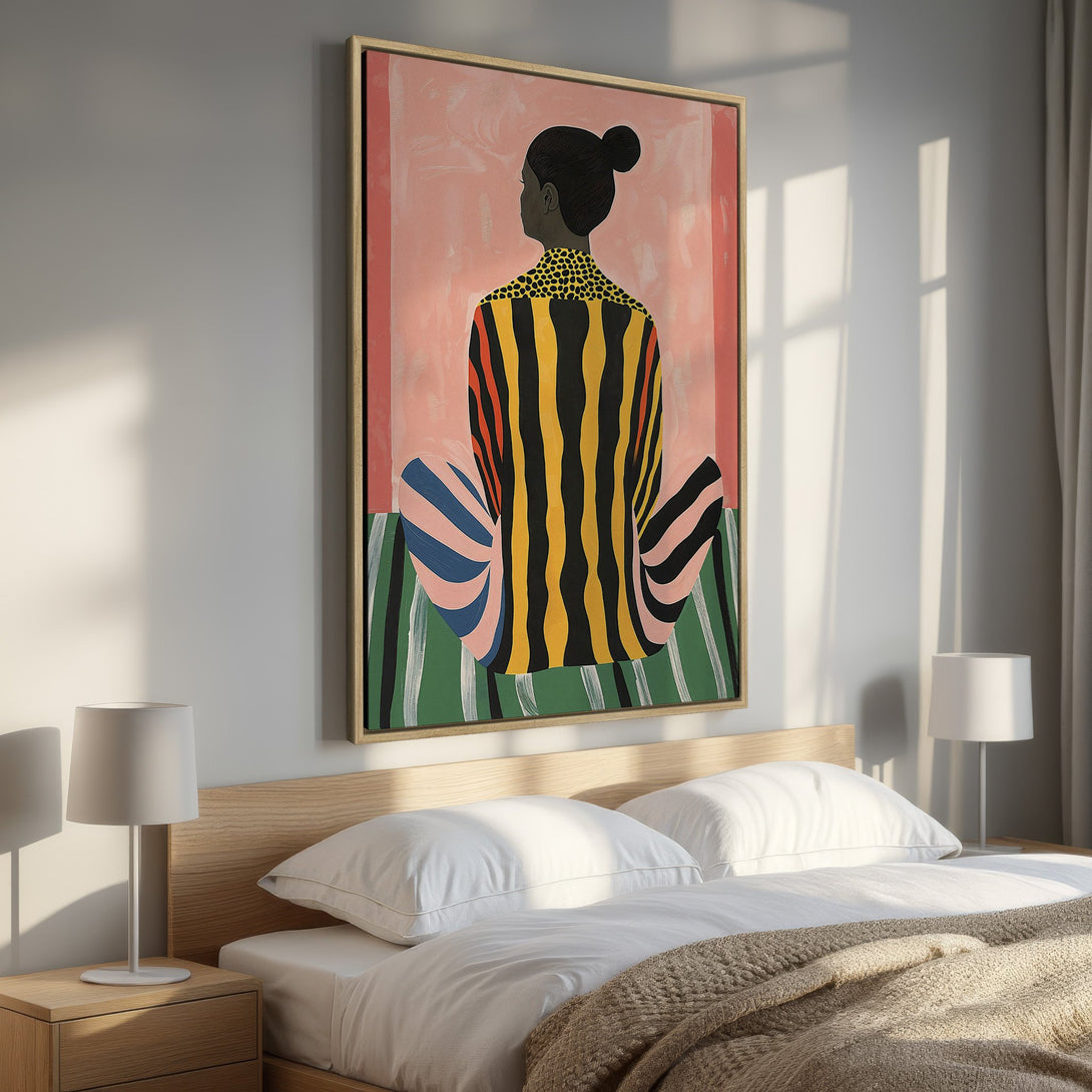 Framed Wall Art featuring a colorful abstract figure. Modern art with pink, yellow, and green palette. Perfect bedroom decor.