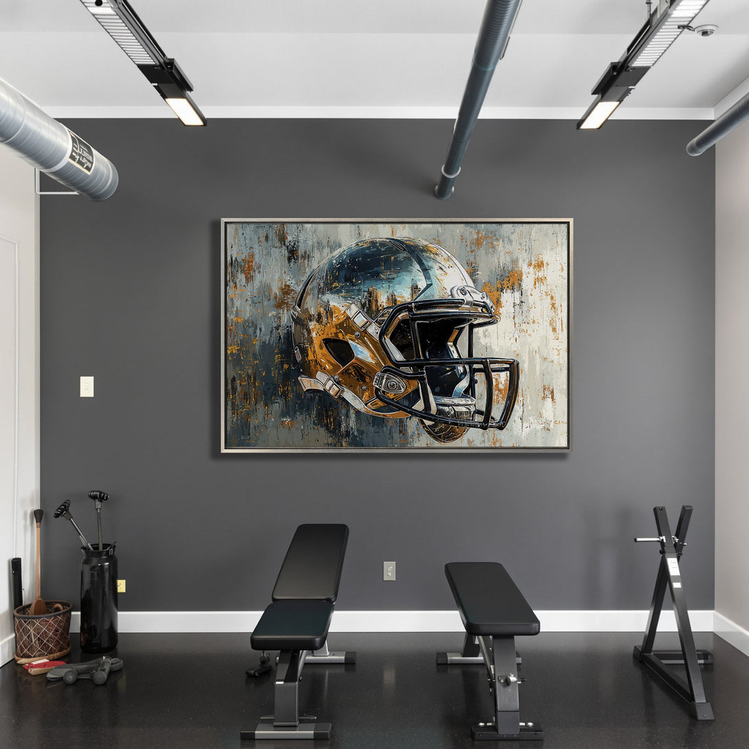 Framed Wall Art: Abstract football helmet art in a modern gym. Grayscale, gold, and blue color palette. Elevate your space with this statement piece!