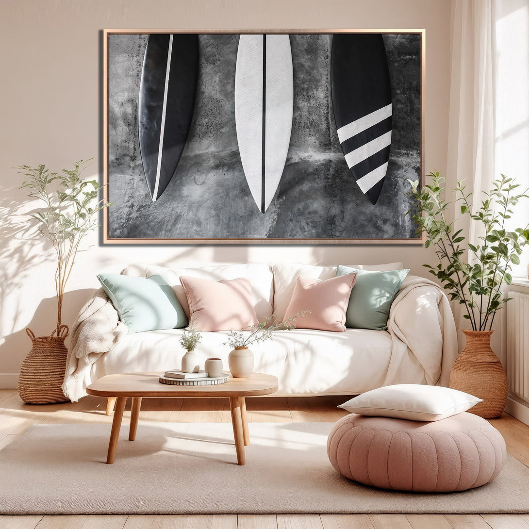 Framed Wall Art featuring surfboards in black and white, modern style, displayed in a neutral-toned living room with pink and green accents.