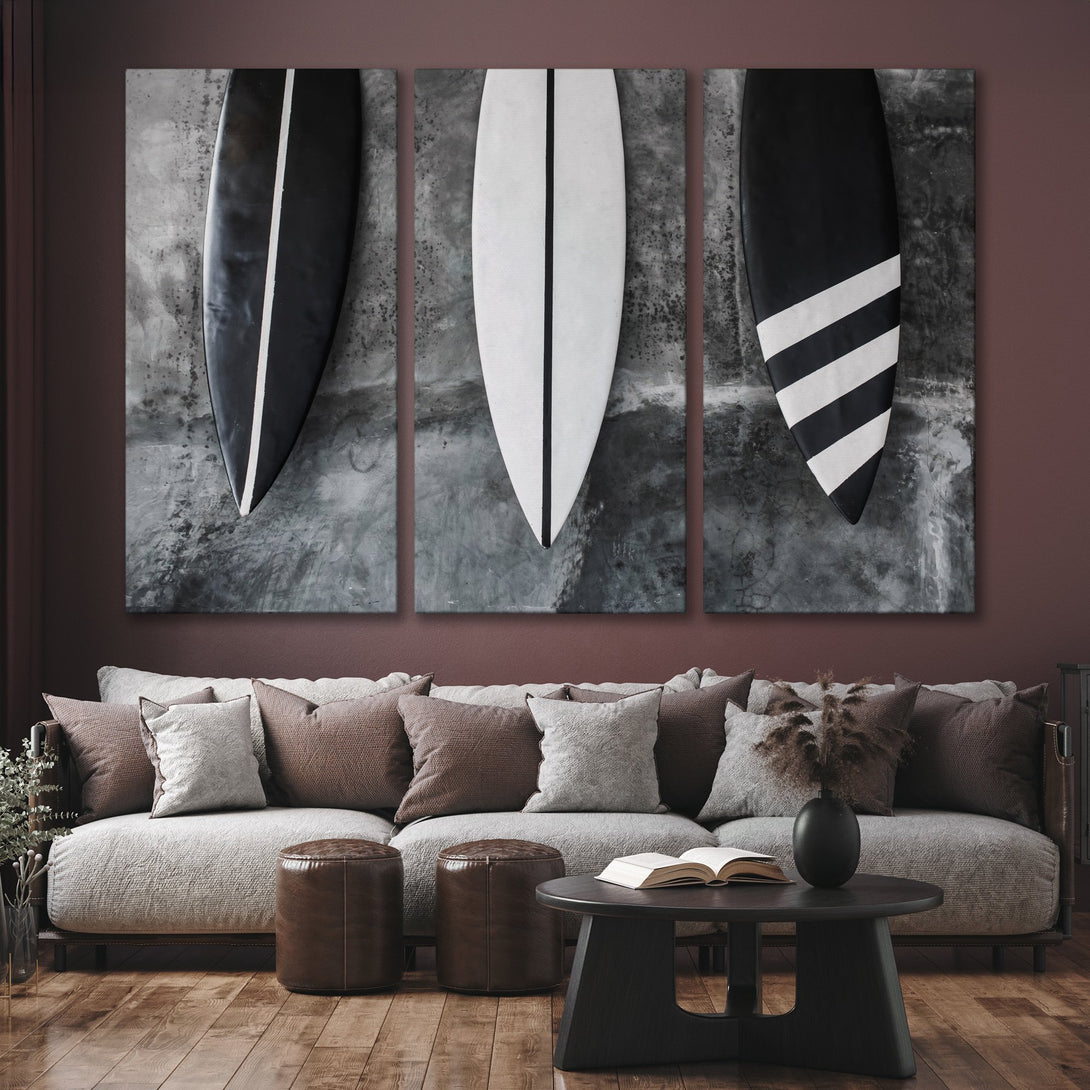 Canvas Print triptych featuring surfboards in black and white. Modern, minimalist style with a neutral color palette. Perfect for coastal decor.