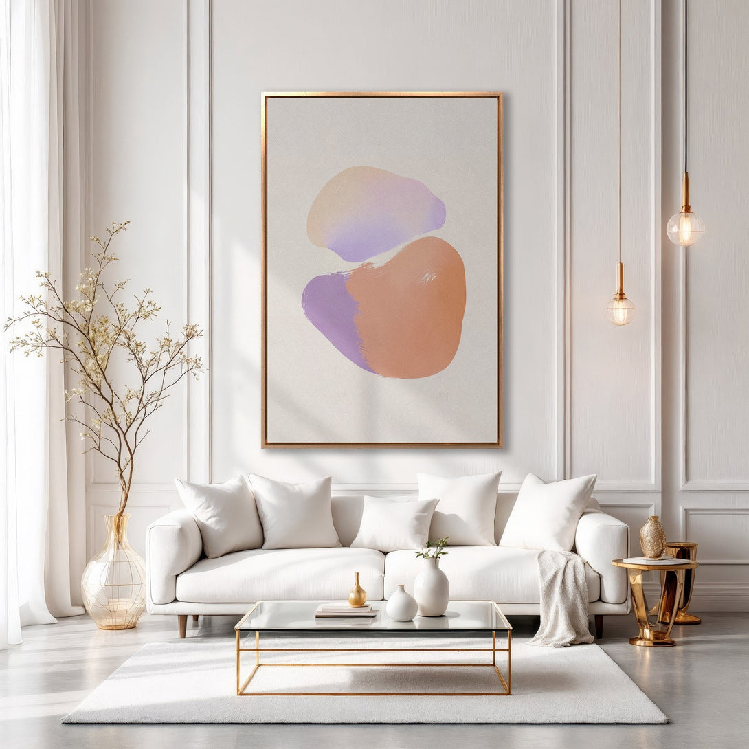 Framed Wall Art: Abstract art in a modern living room. Features a canvas print with soft peach and purple hues. Perfect for adding a touch of elegance.