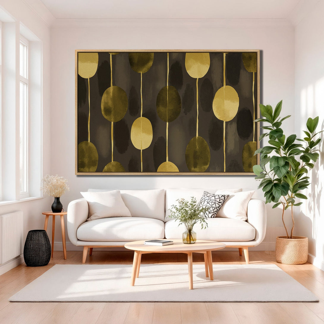 Framed Wall Art featuring abstract gold and olive shapes on a dark background. Modern art for a stylish living room.