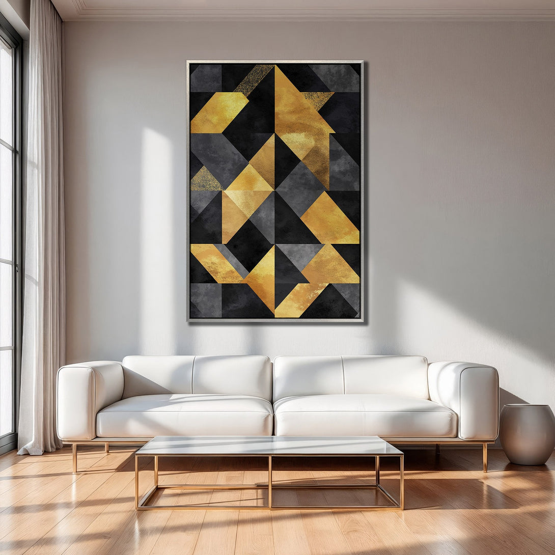 Framed Wall Art featuring a geometric abstract design in gold, black, and gray. Modern interior decor inspiration.