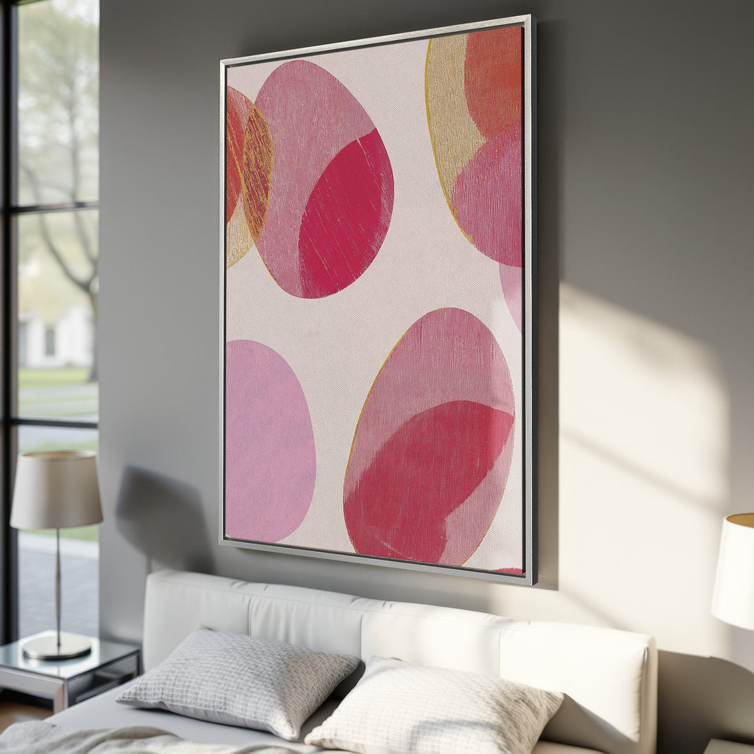 Framed Wall Art featuring abstract pink and red circles. Modern art canvas print with a neutral background, perfect for bedroom decor.
