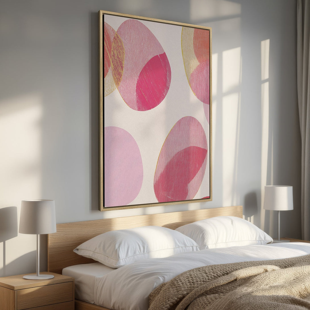 Framed Wall Art: Abstract pink and gold circles canvas print. Modern art in a bedroom setting. Adds a pop of color and style.