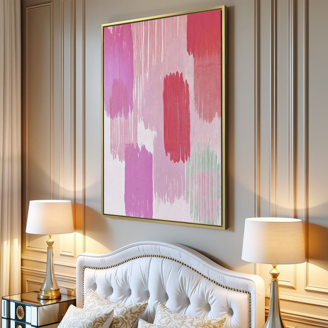Abstract Canvas Print with pink and red brushstrokes. Modern wall art adds a pop of color to any living room.