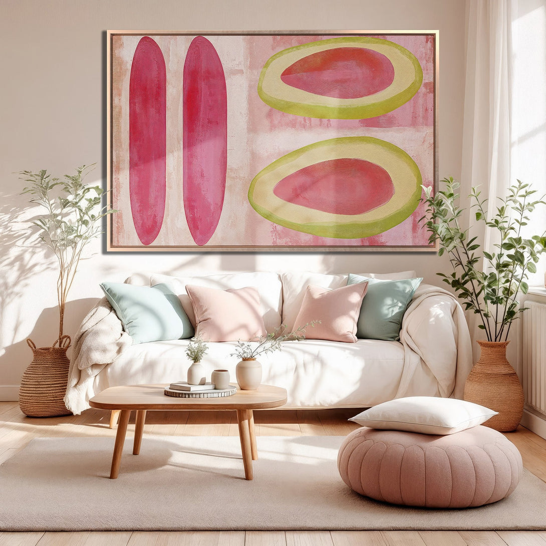 Framed Wall Art featuring abstract pink and green shapes. Modern art canvas print adds a pop of color to a neutral interior.
