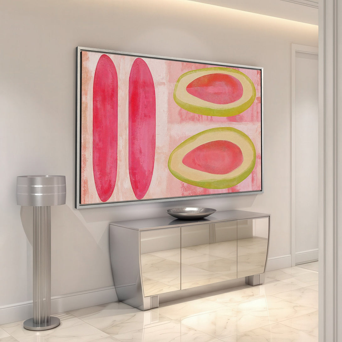 Framed Wall Art featuring abstract fruit art in pink and green hues. Modern style canvas print adds a pop of color to any interior space.
