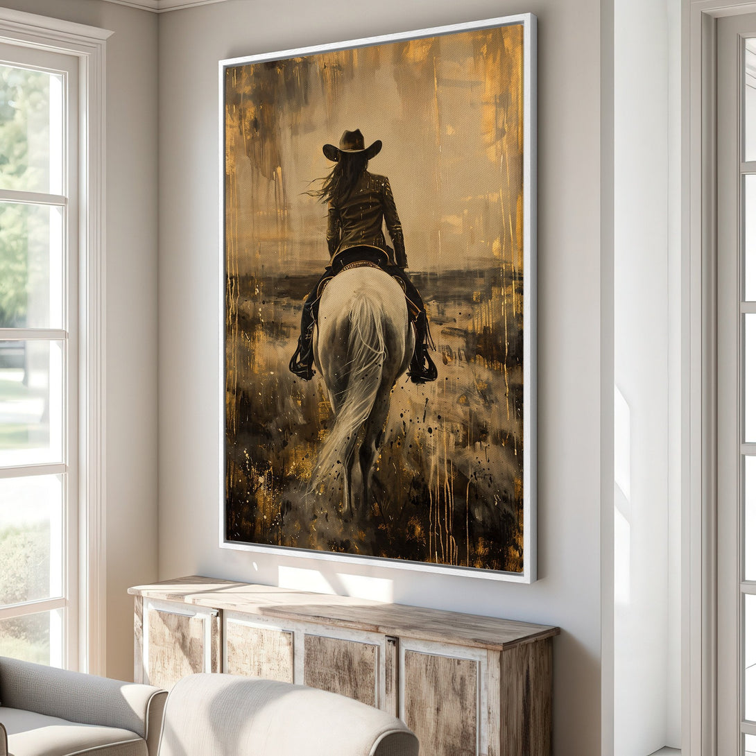 Framed Wall Art: Stunning canvas print of a cowgirl on horseback, in a warm gold and black abstract style. Perfect for adding a touch of rustic elegance.