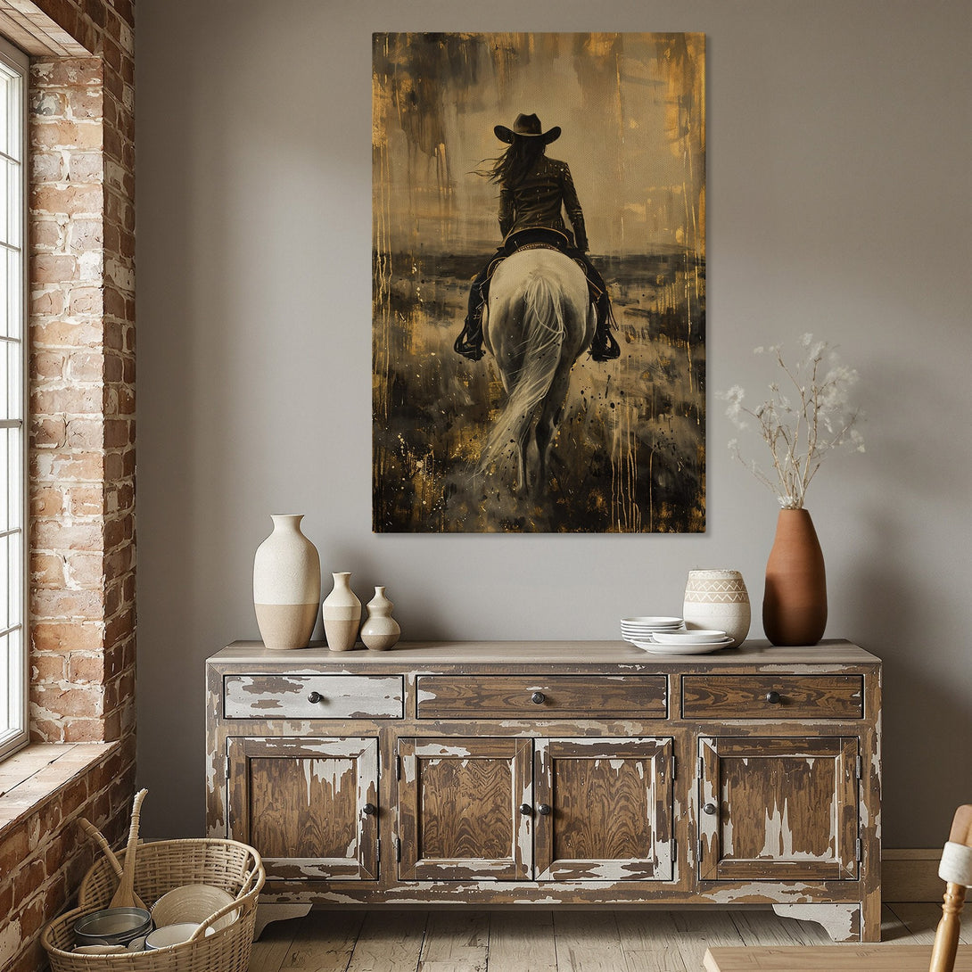 Framed Wall Art: Cowgirl on Horseback. Abstract style with gold, black, and beige tones. Perfect for rustic or modern home decor. Shop now!