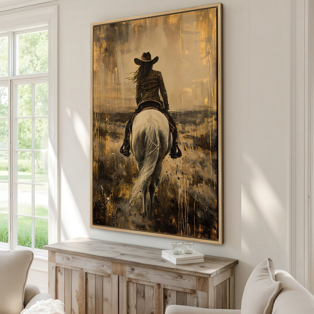 Framed Wall Art: Abstract painting of a cowgirl on a white horse. Gold and black tones create a dramatic, stylish canvas print for your home.