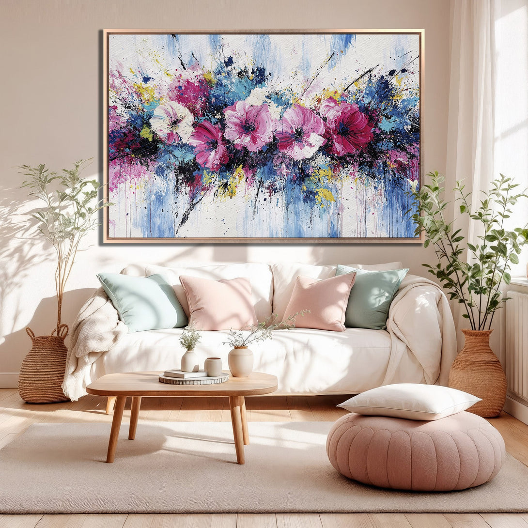 Framed Wall Art featuring abstract floral painting. Modern style with a vibrant palette of pink, blue, and yellow. Perfect for living room decor.