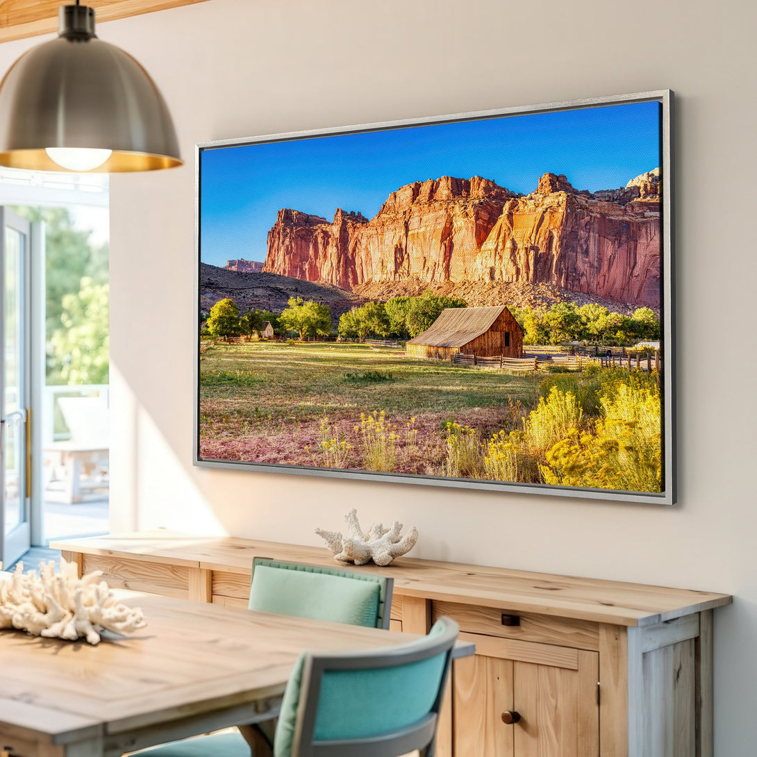 Framed Wall Art: Stunning landscape canvas print featuring a barn and majestic red rock formations. Warm, earthy color palette perfect for any room.