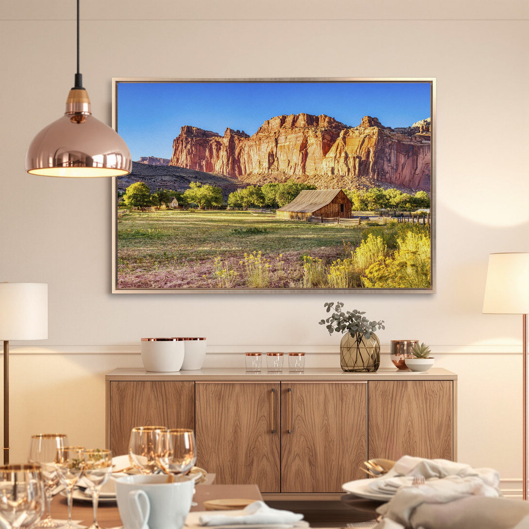 Framed Wall Art: Landscape Canvas Print featuring a barn and mountains in warm, earthy tones. Perfect for adding rustic charm to your home decor.