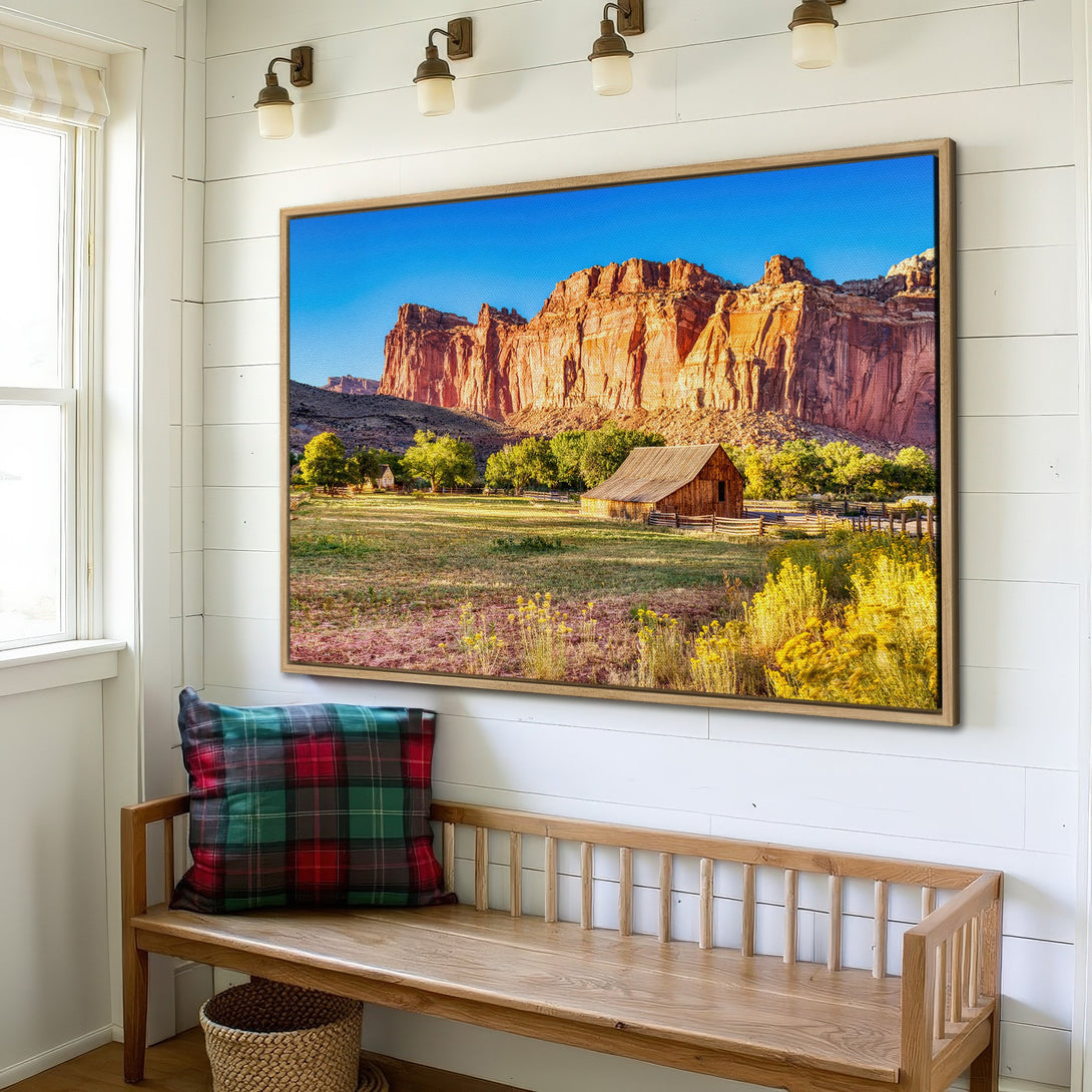 Framed Wall Art: Landscape Canvas Print of a rustic barn and red rock mountains, warm color palette, perfect for farmhouse decor.