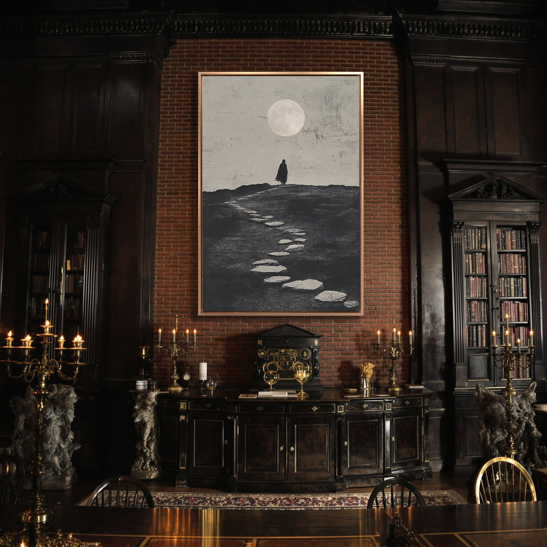 Framed Wall Art with a lone figure under a full moon. Moody, minimalist style in grayscale, adding a touch of mystery to any space.