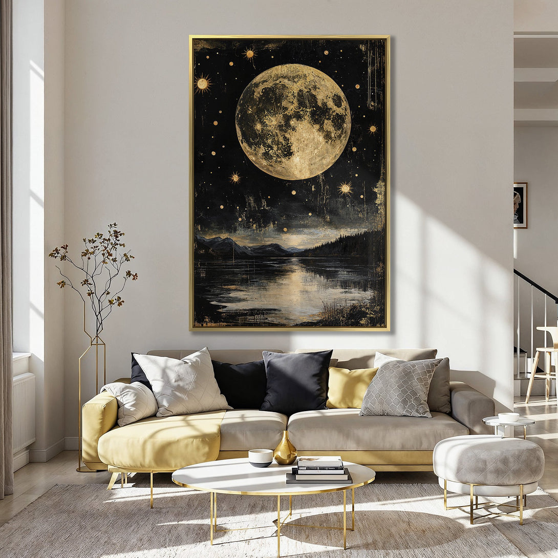 Canvas Print of a celestial moon and landscape scene in gold and black, displayed in a stylish interior with a pink wall.