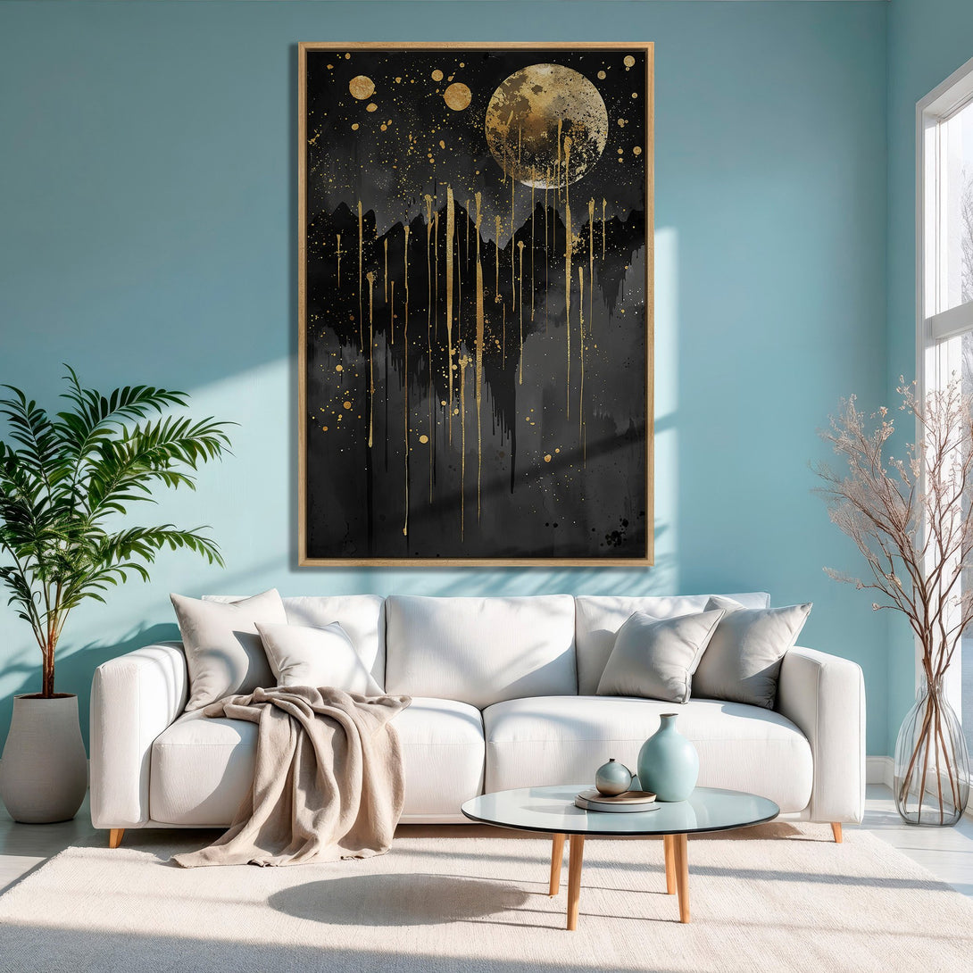 Framed Wall Art: Abstract gold and black moonscape canvas print. Modern art decor in a living room with a teal wall and white sofa.