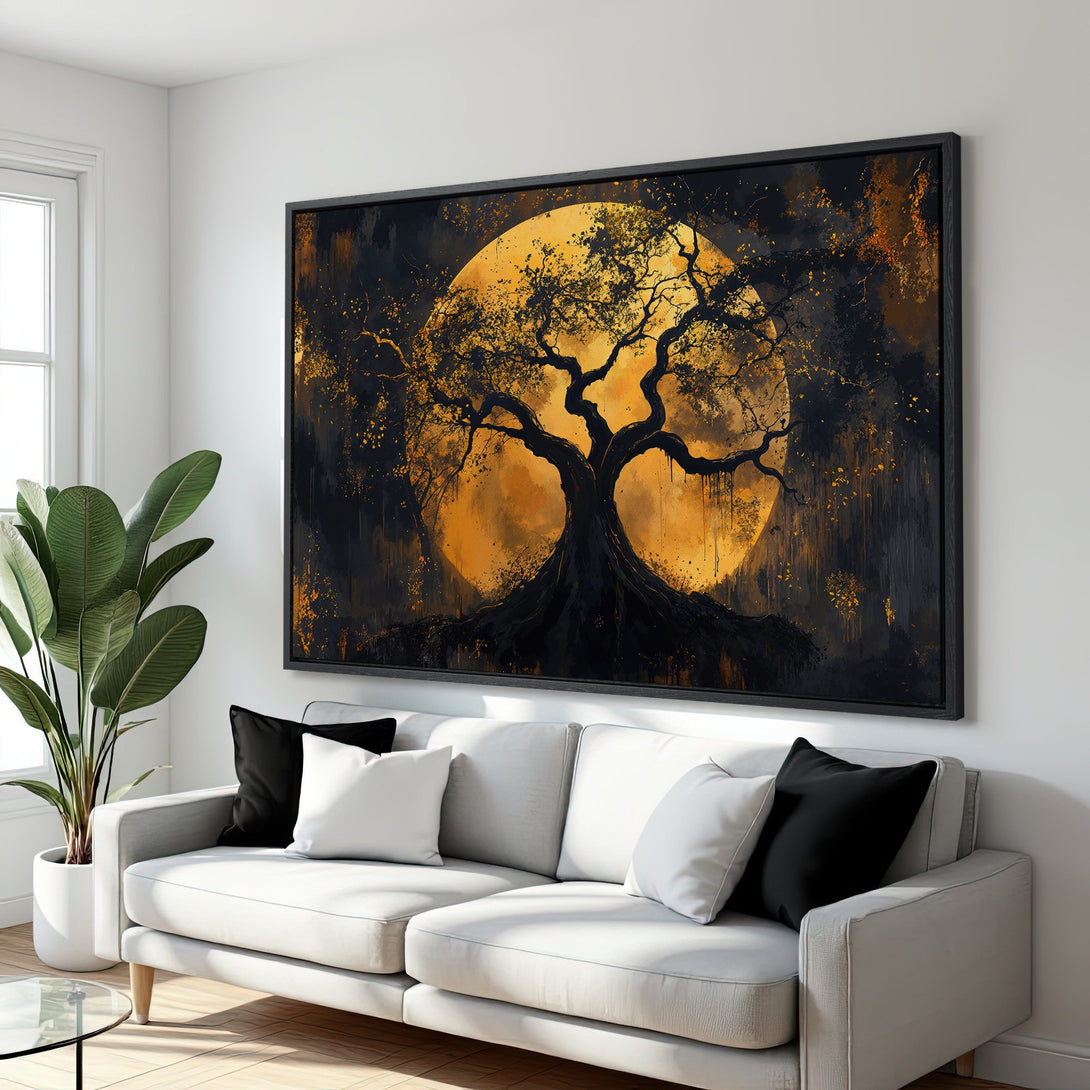 Framed Wall Art featuring a dramatic tree silhouette against a golden moon. Modern abstract style with a black and gold color palette, perfect for home decor.