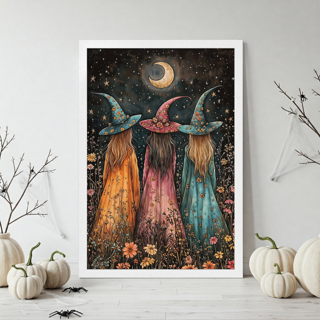 Framed Poster featuring three witches under a starry night sky, whimsical style, warm color palette with orange, pink, and teal tones.