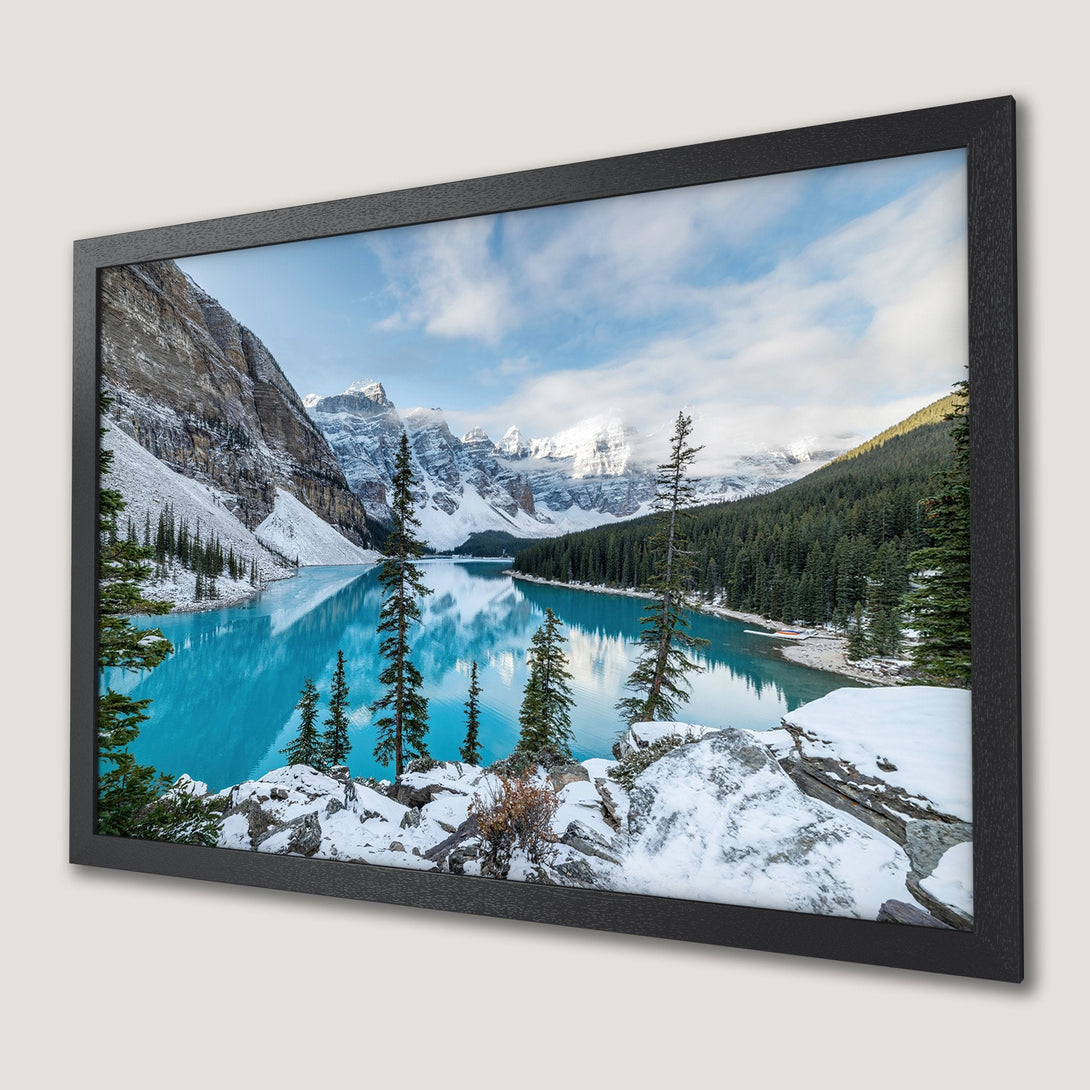 Framed Poster of a stunning mountain lake scene. Features turquoise water, snow-capped peaks, and a cool, natural color palette. Bring nature indoors!