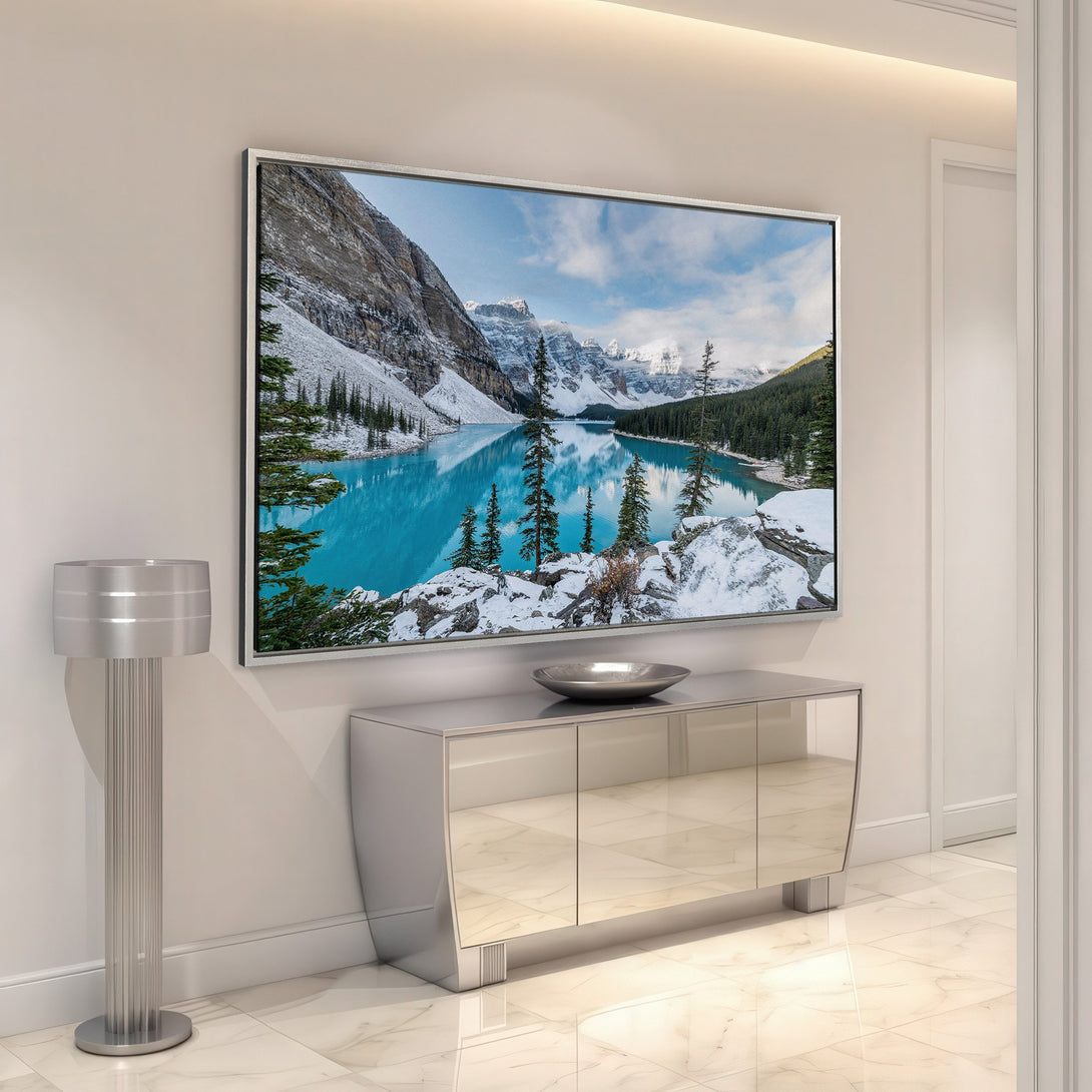 Framed Wall Art Canvas Print of a serene mountain lake scene in blue, white, and green hues, adding a touch of nature to any modern interior.