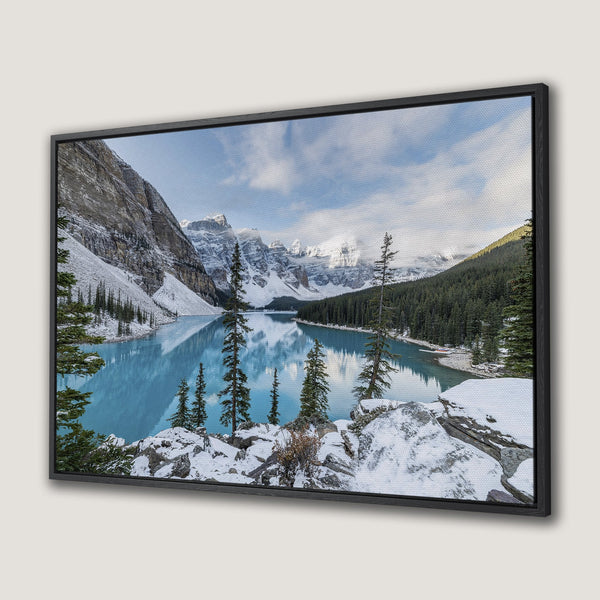 Framed Wall Art of Moraine Lake in the Canadian Rockies. Stunning landscape canvas print with turquoise water, snow-capped mountains, and evergreen trees.