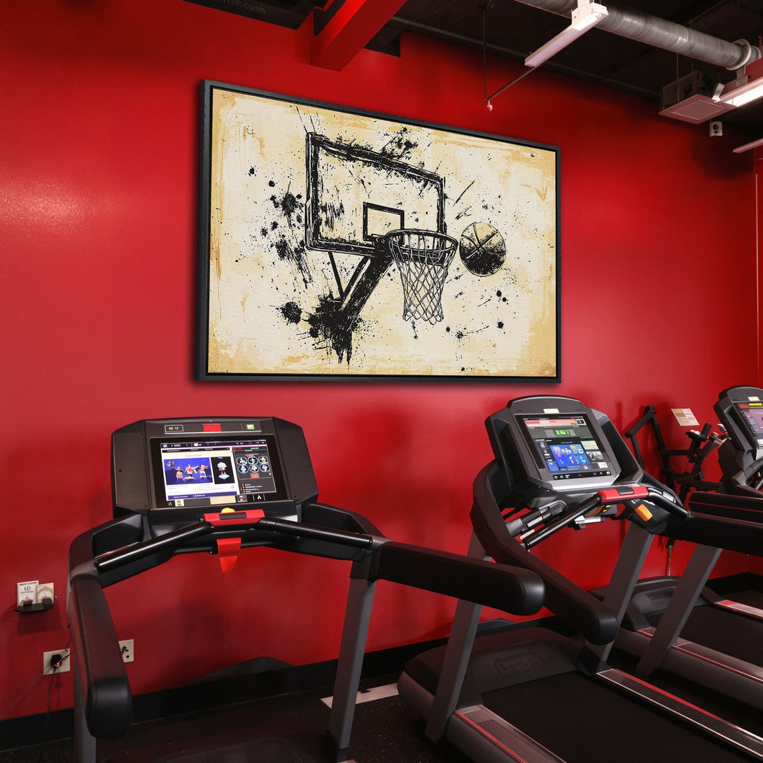 Framed Wall Art: Abstract basketball art in a gym. Black and beige tones pop against a vibrant red wall. Elevate your space with sports-themed decor.