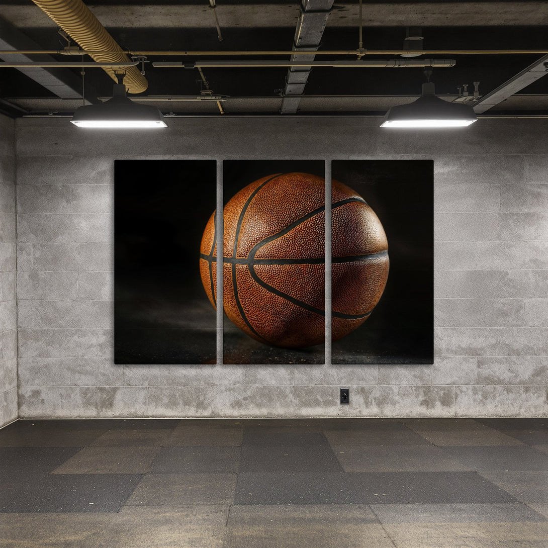 Canvas Print of a basketball in a dark, moody style. Warm brown tones pop against the grey interior. Elevate your space with this striking wall art.