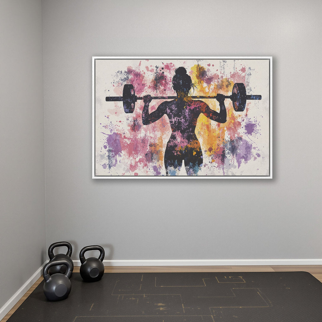 Framed Wall Art: Watercolor silhouette of a woman lifting weights, vibrant splash of color. Perfect for home gym decor.