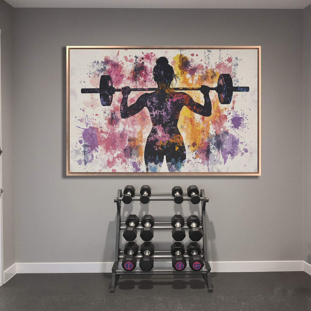 Framed Wall Art: Abstract watercolor Canvas Print of a woman lifting weights. Vibrant pink, purple, and yellow splashes on a neutral background.