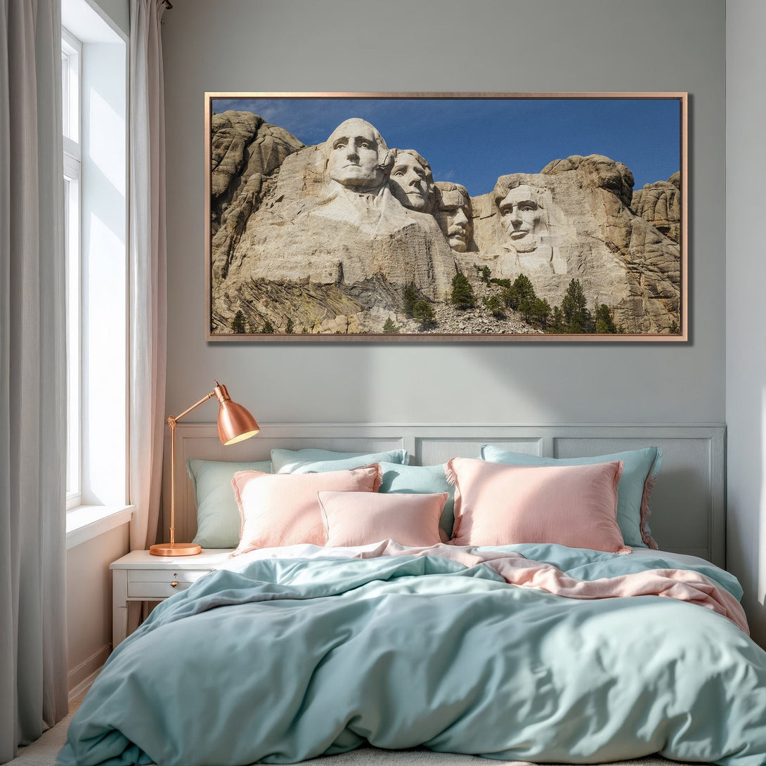 Framed Wall Art of Mount Rushmore in a bedroom. Modern decor with a neutral color palette and pops of blue and pink. Elevate your space!