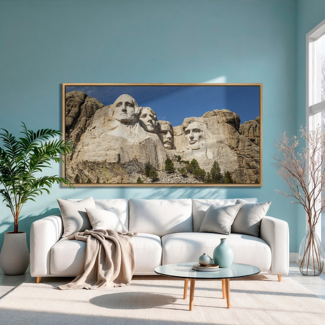 Framed Wall Art of Mount Rushmore in a modern interior. Neutral color palette with blue walls. Elevate your space with this stunning canvas print!