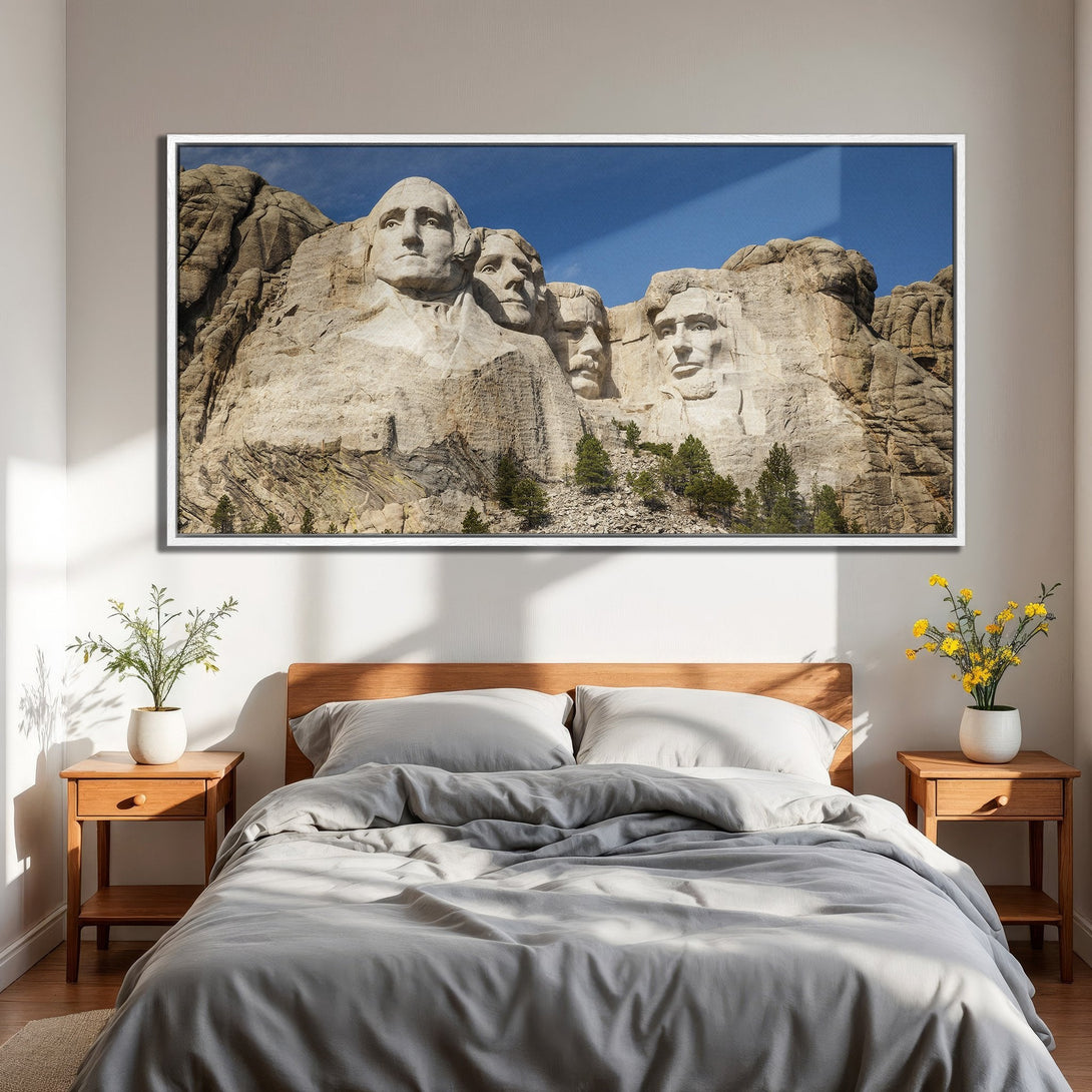 Framed Wall Art of Mount Rushmore in a bedroom. Earthy tones and blue sky create a stunning, patriotic Canvas Print for your home decor.