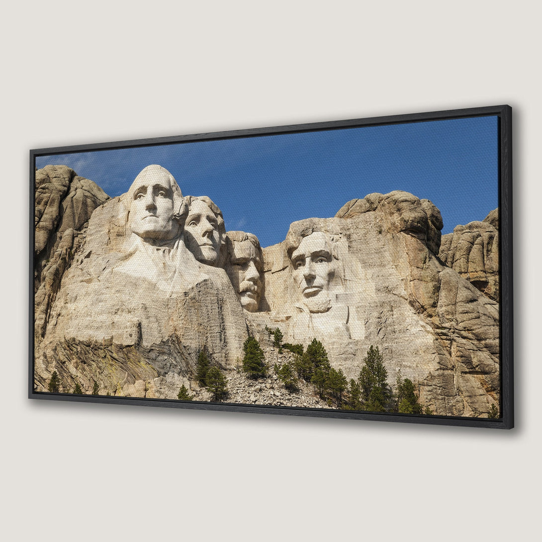 Framed Wall Art: Mount Rushmore canvas print. Iconic American landmark in neutral tones with blue sky. Perfect for home decor!