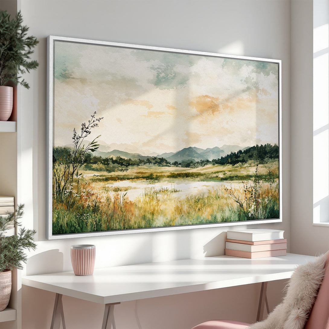 Framed Wall Art featuring a serene landscape painting in watercolor style, with a warm, earthy color palette of greens, yellows, and blues.