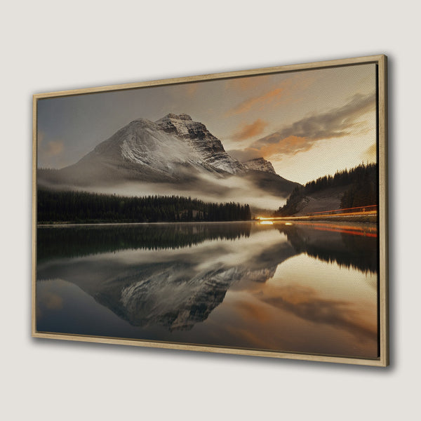 Framed Wall Art: Mountain landscape canvas print with warm sunset colors. Nature-inspired wall decor for a calming atmosphere.