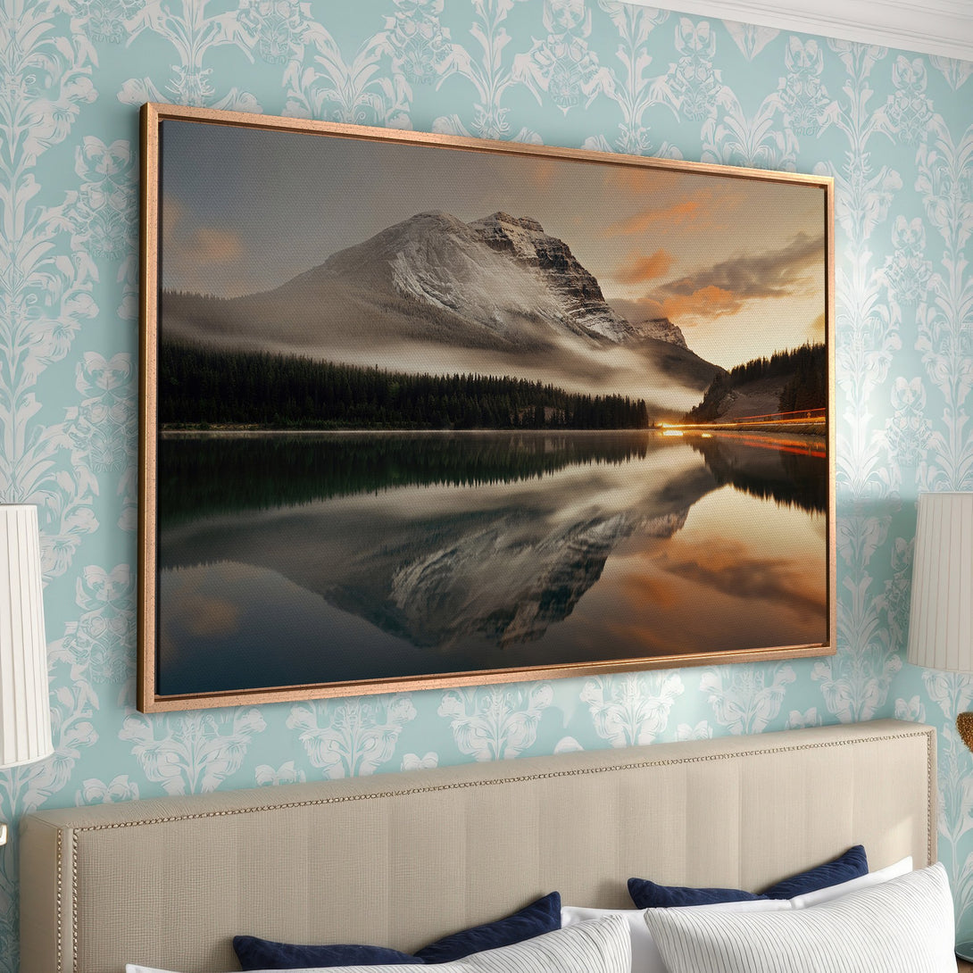 Framed Wall Art: Mountain landscape Canvas Print in a bedroom. Featuring a serene lake reflection, warm sunset hues, and cool teal tones. Perfect for home decor.