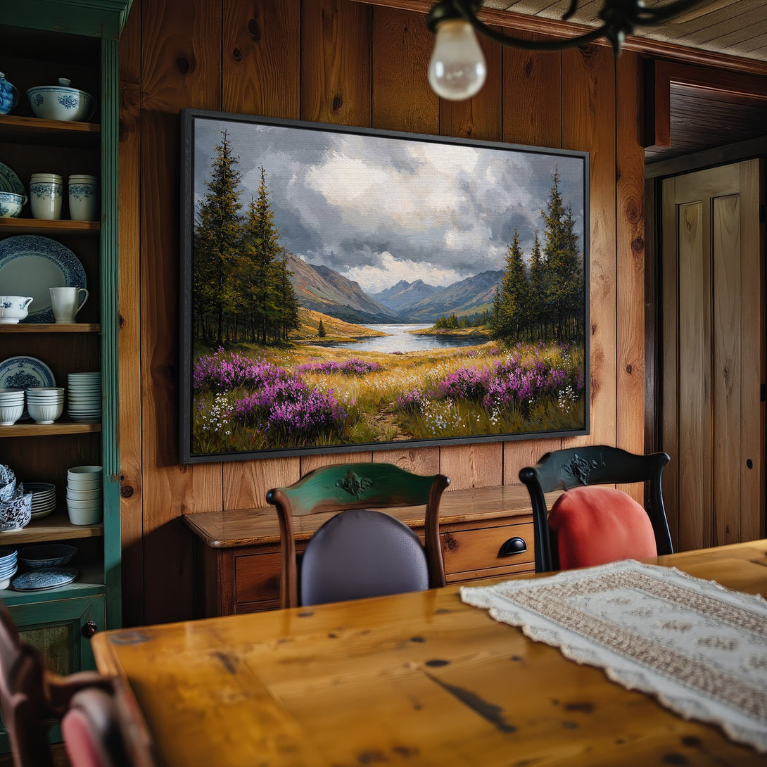Framed Wall Art: Landscape painting with a moody sky, purple flowers, and a serene lake. Earthy tones create a cozy, inviting atmosphere.