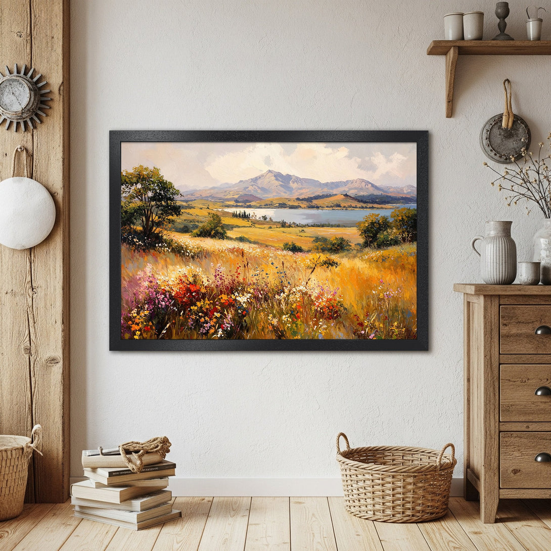 Framed Poster of a scenic landscape painting in warm tones. Captures a serene meadow with mountains and a lake. Perfect wall art!
